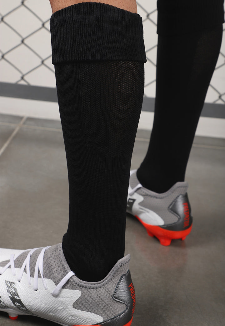 Medias de fútbol profesionales JOGO, tejido reforzado en punta y talón aumenta la durabilidad y seguridad en cada pisada, mientras que la zona de ventilación en pantorrillas favorece la frescura y el control de la humedad